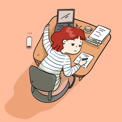 A girl lying on her desk feeling burntout.