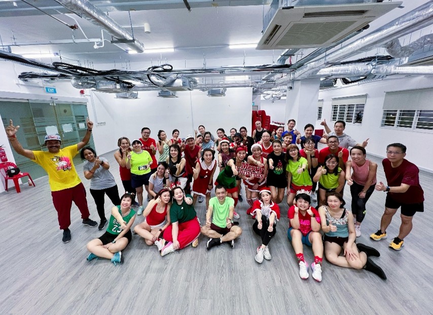 Pictures of me with the dance fitness community taken during an advanced Chirstmas celebration workout.