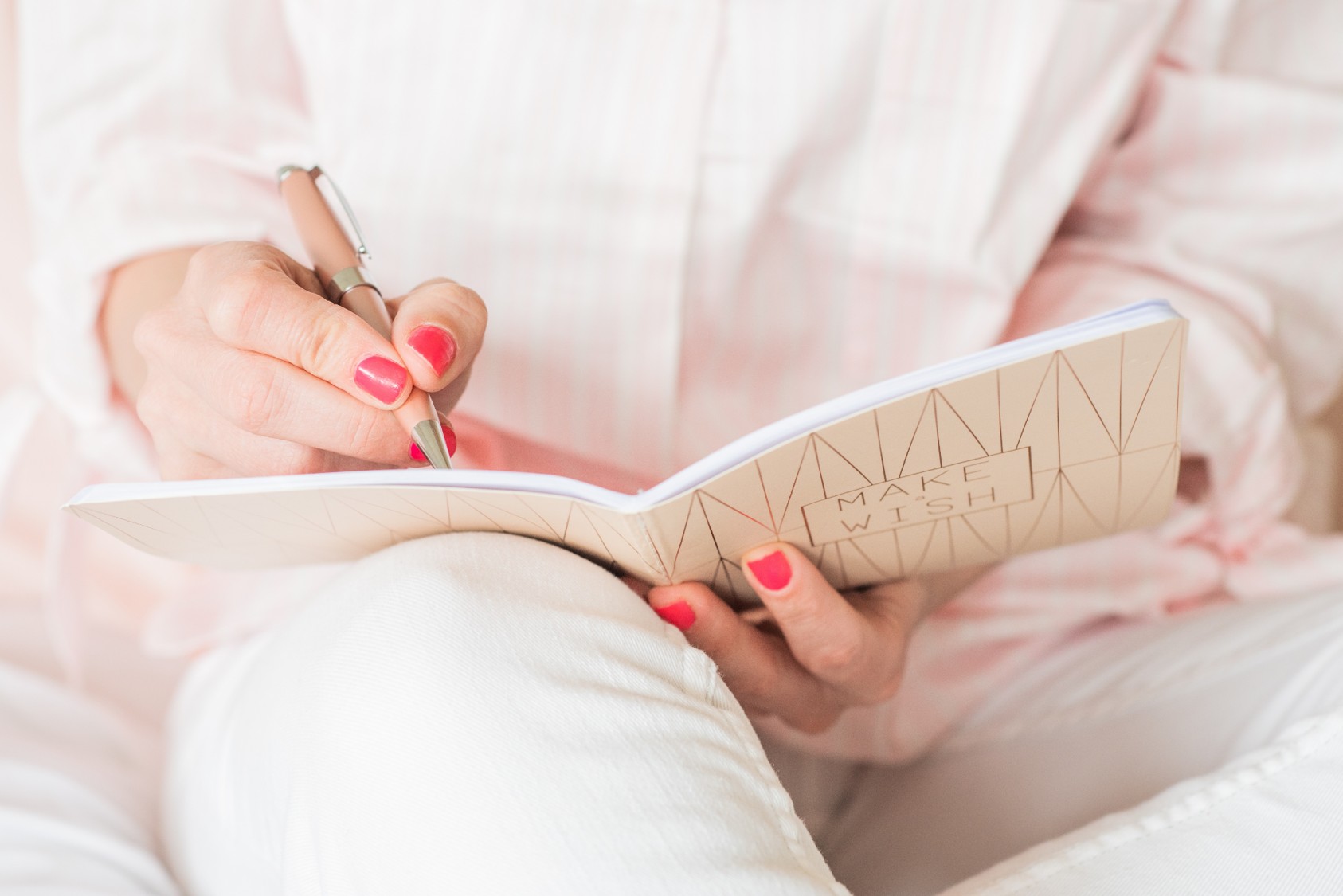 A woman writing a journal.